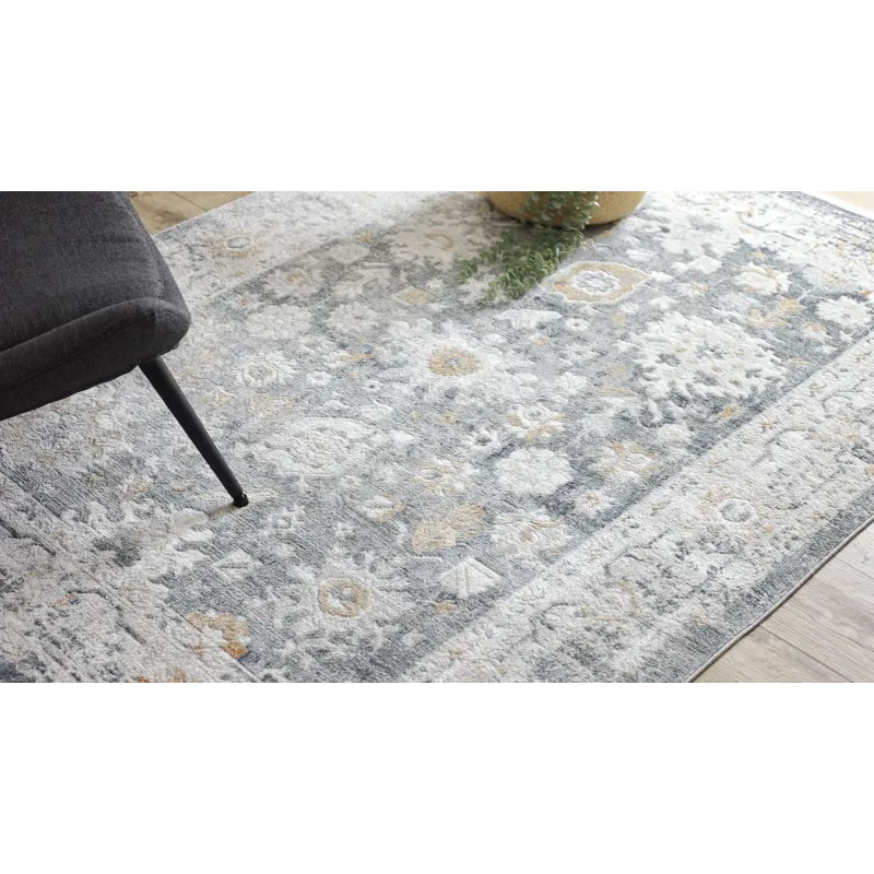 Elegáns szürke és fehér mintás szőnyeg, tökéletes a nappaliba